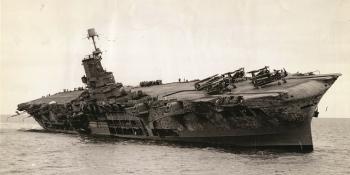 The sinking HMS Ark Royal, with a heavy list, taken from HMS Hermione.